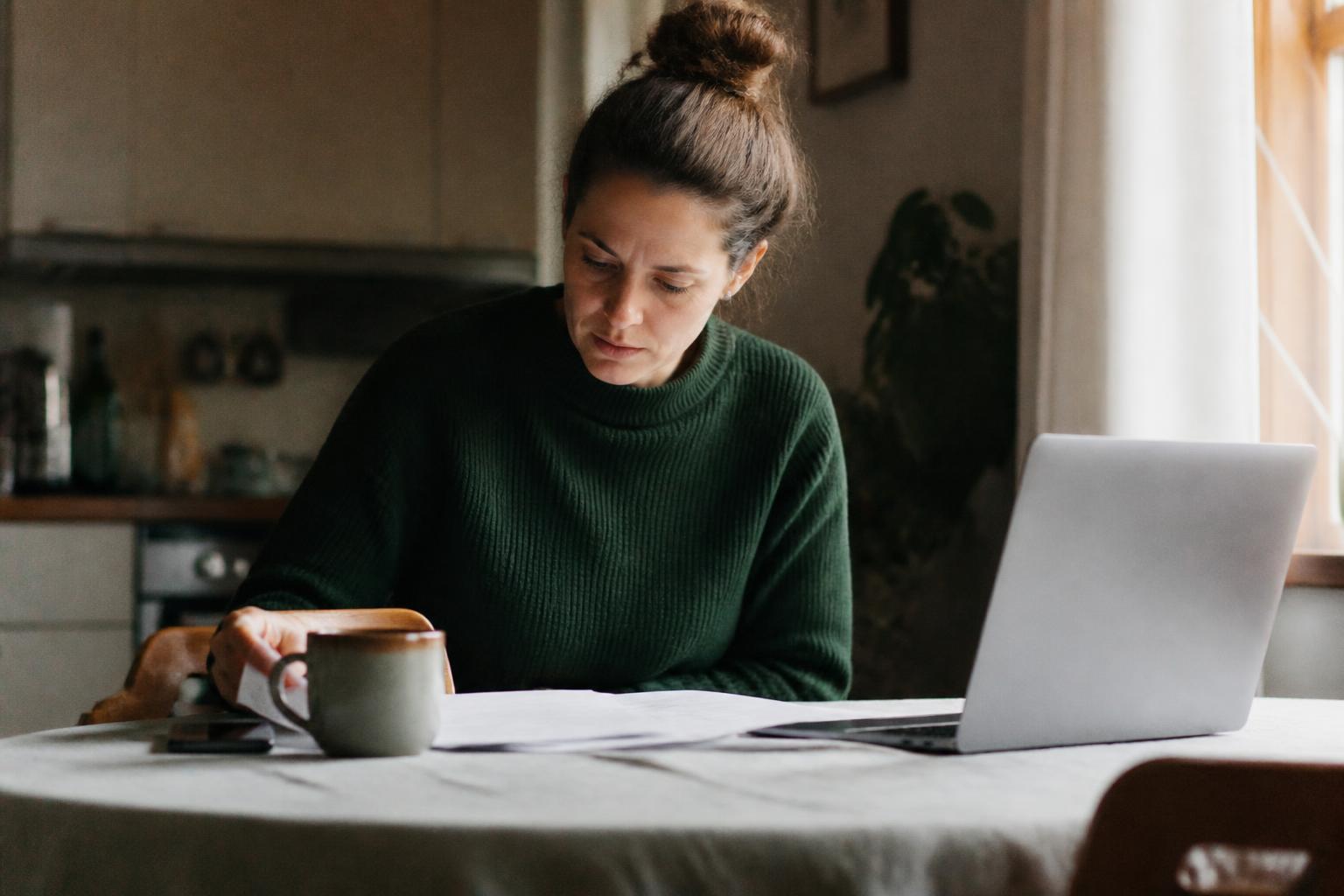 A customer reviewing her accounts at home